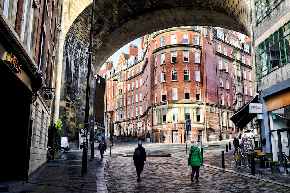 a brick walkway between buildings