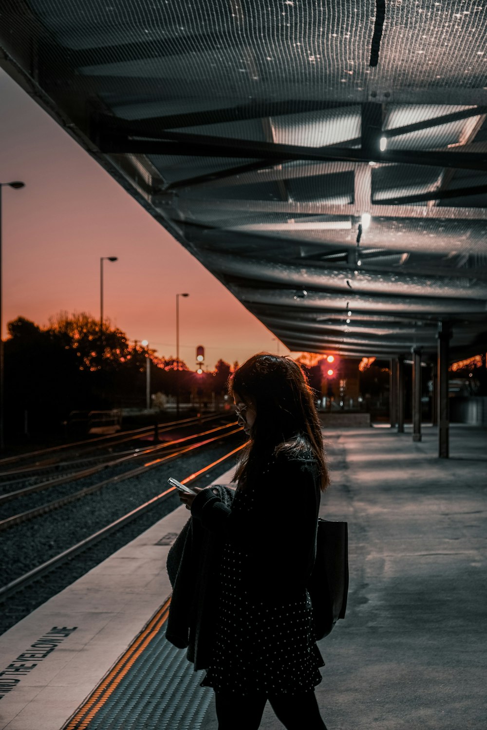 a person standing on a train platform