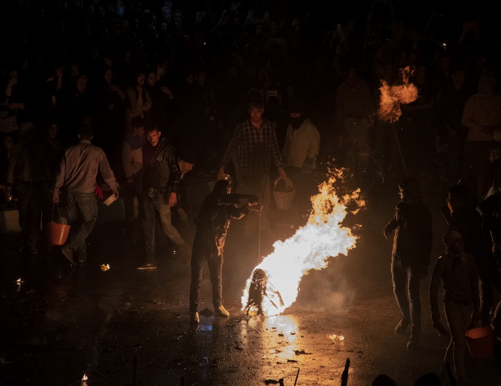 a group of people around a fire