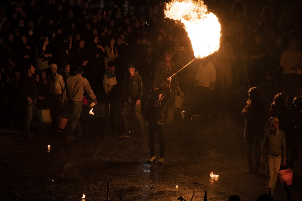 a group of people around a fire