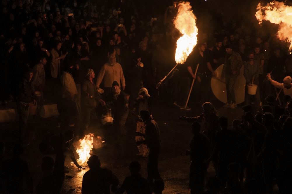 a group of people around a fire