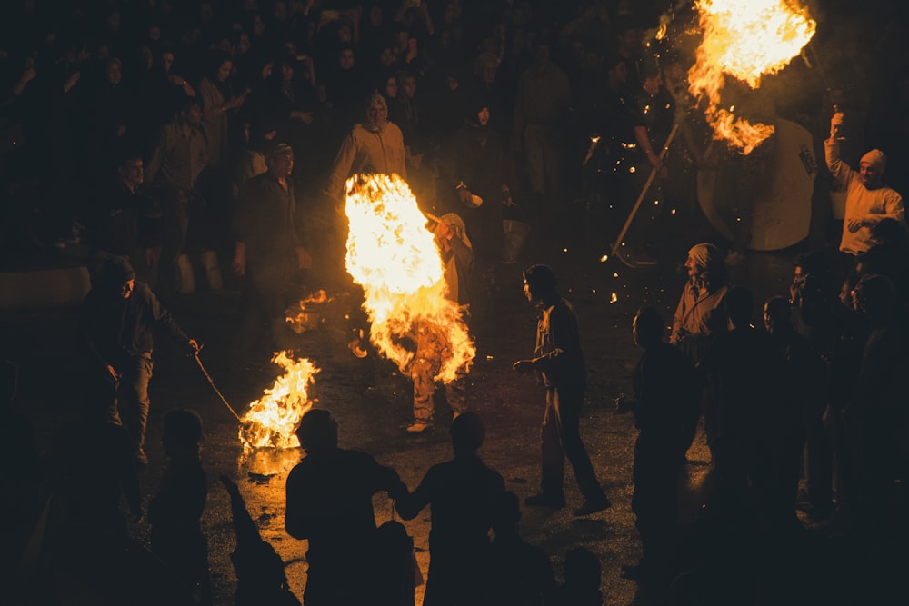 a group of people around a fire