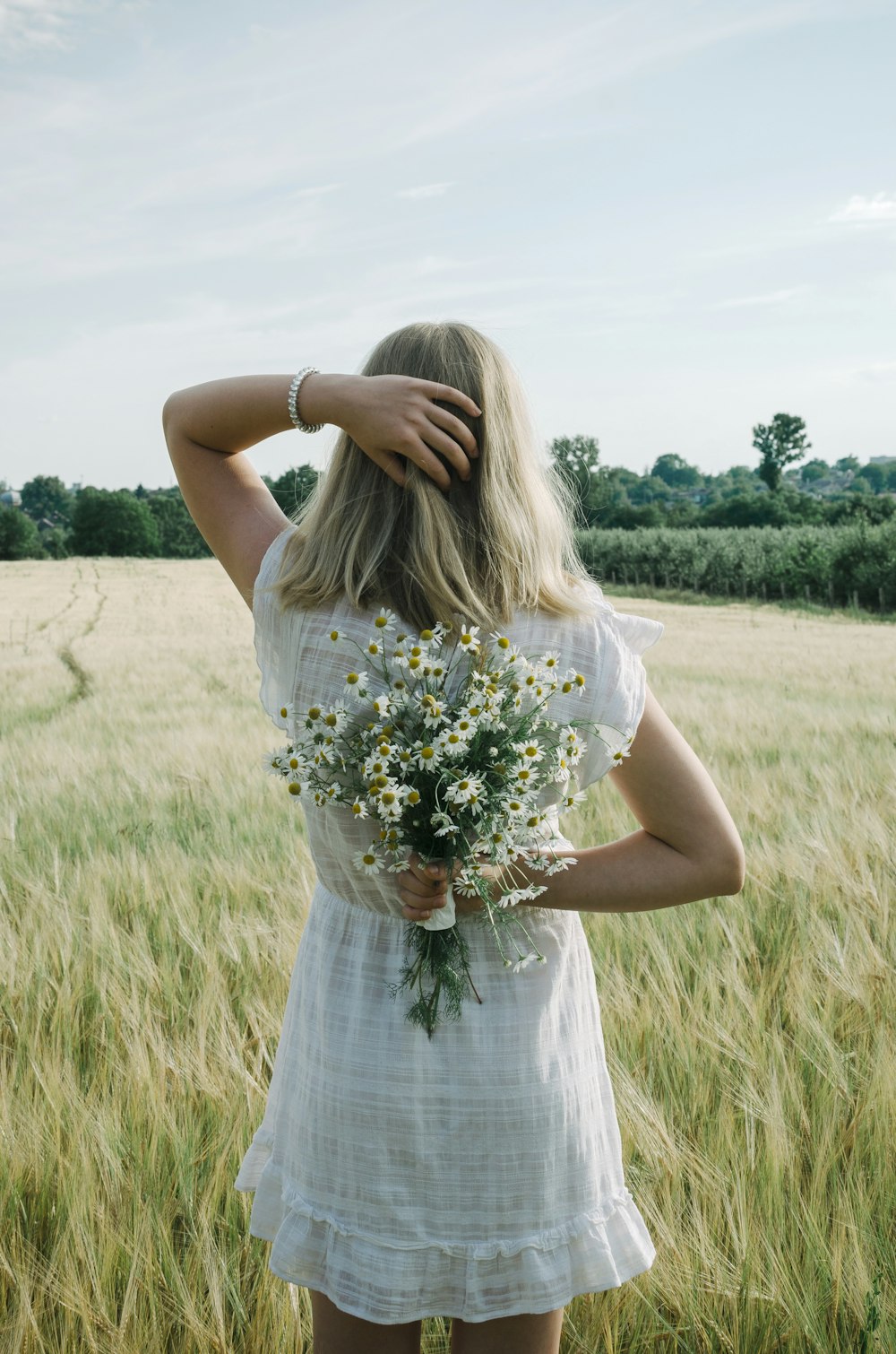 a woman holding flowers