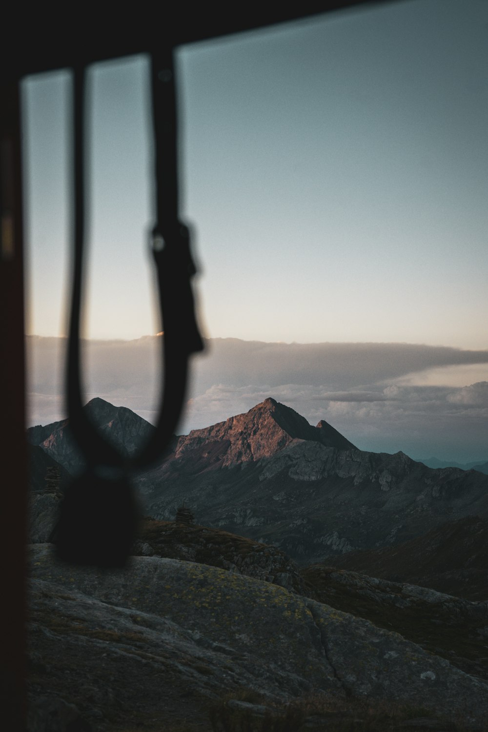 a view of a mountain range from a window