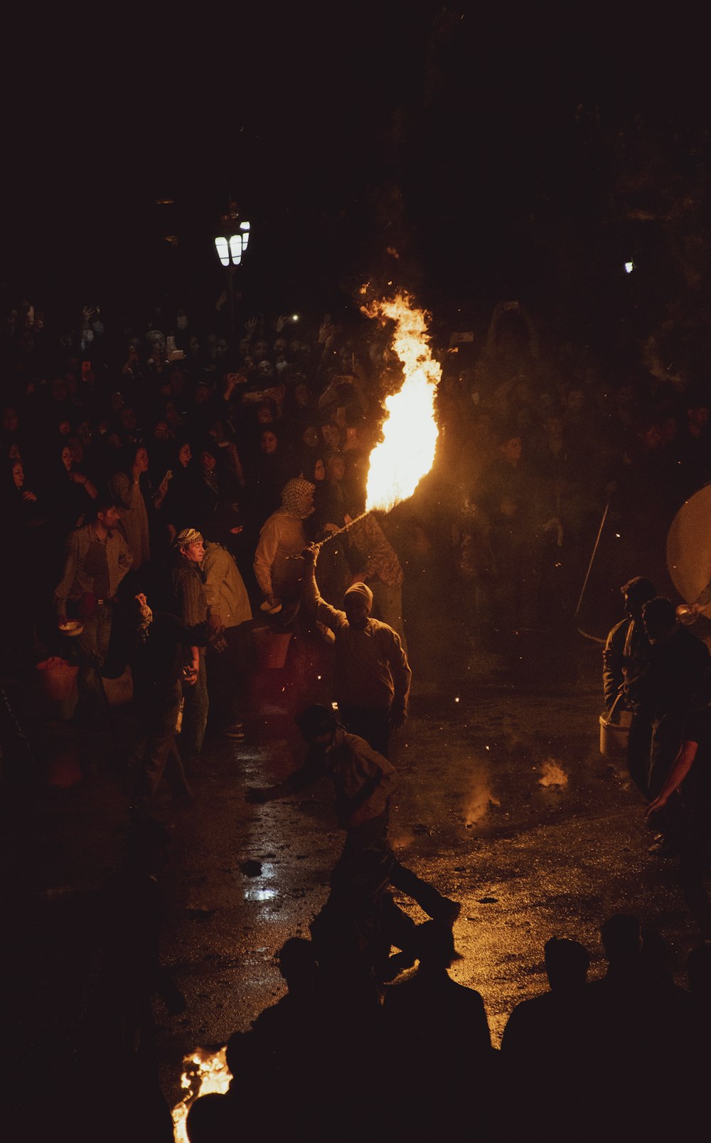 a group of people around a fire