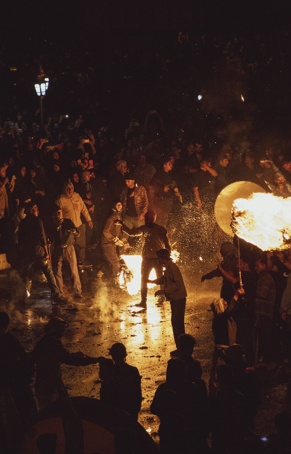 a group of people around a fire