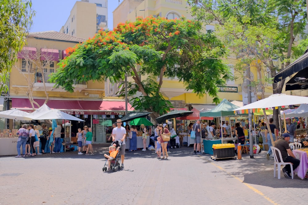 a group of people at an outdoor market