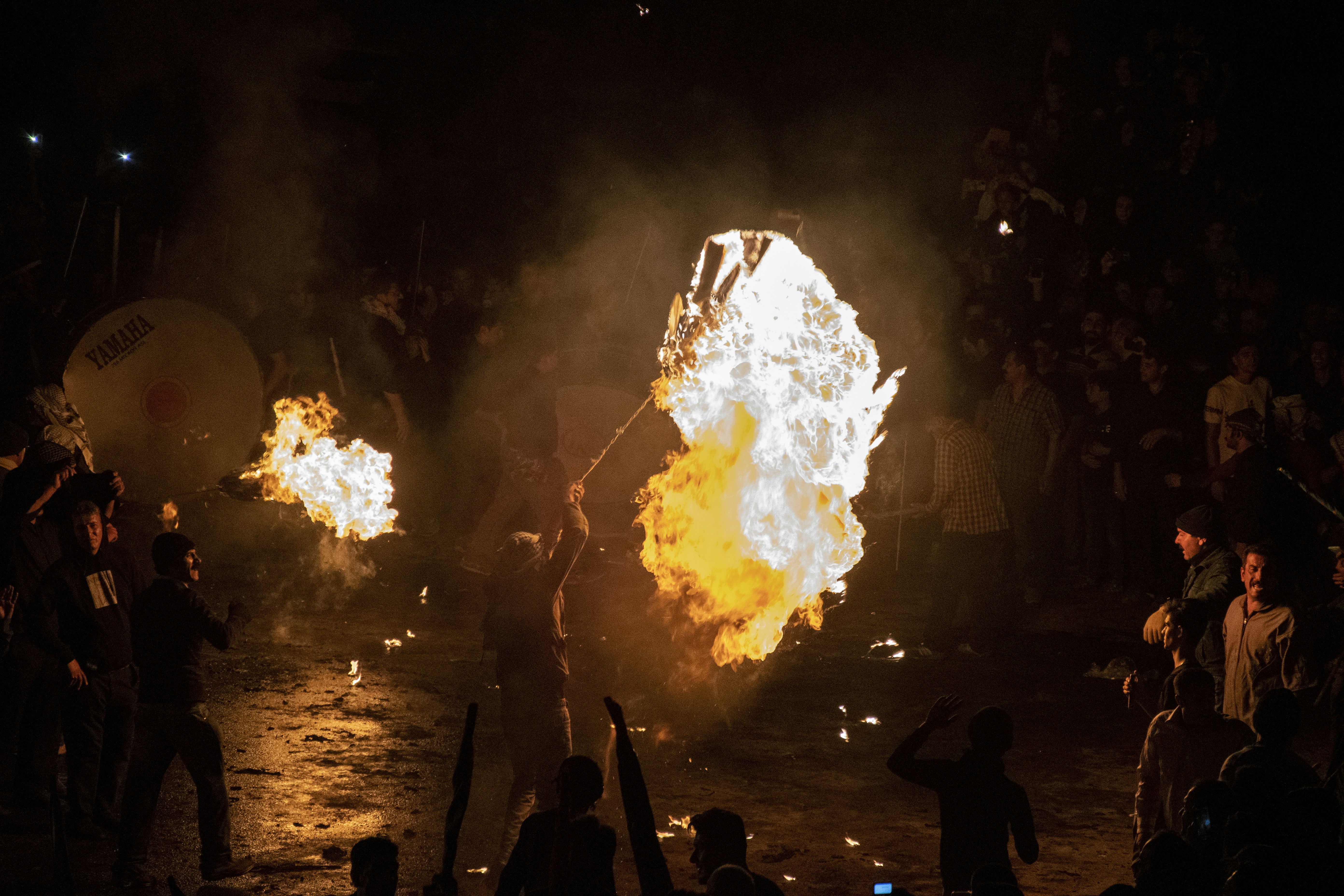 a group of people watching a fire