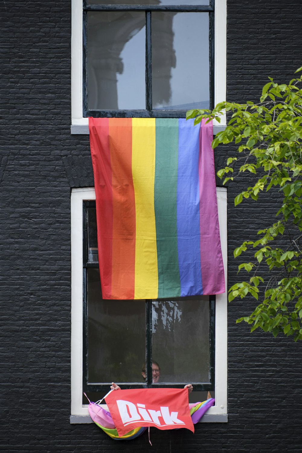 a group of flags from a building