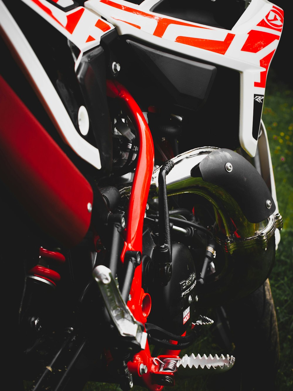 a motorcycle helmet with a red and white stripe