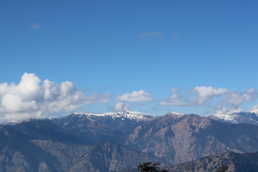 a mountain range with clouds