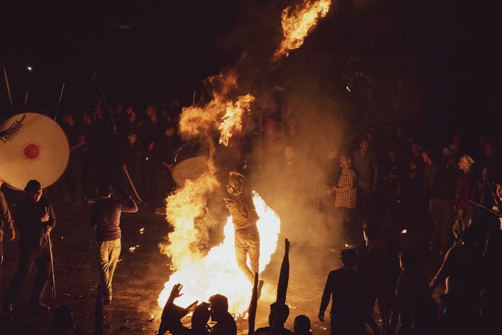 a group of people around a fire