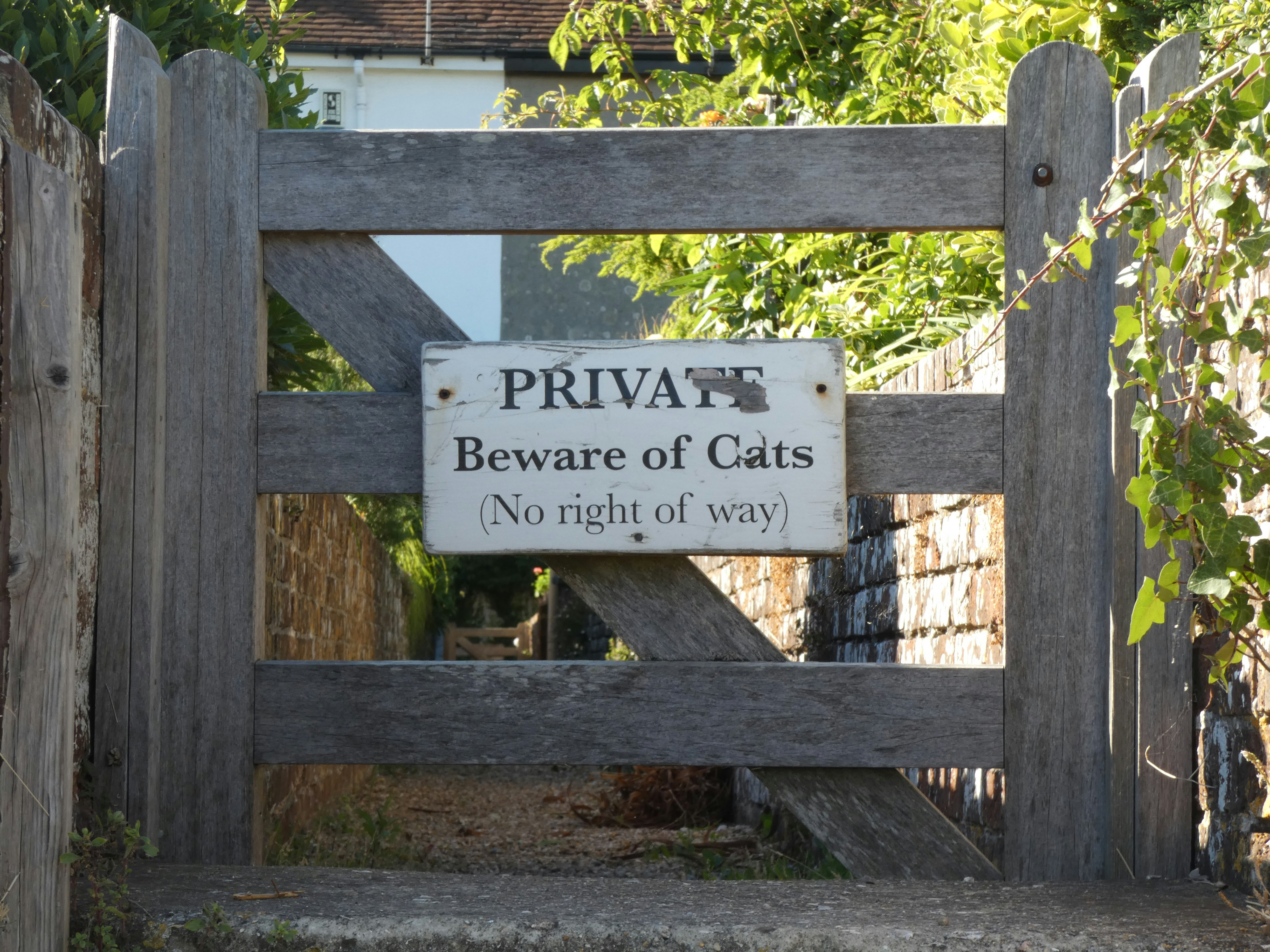 a sign on a wooden fence