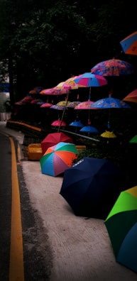 A collection of colorful patio umbrella stands on display.