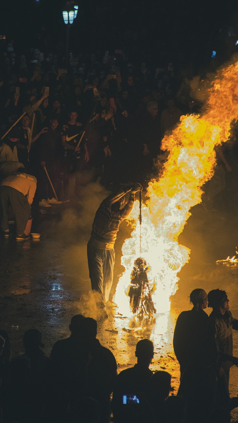 a group of people around a fire