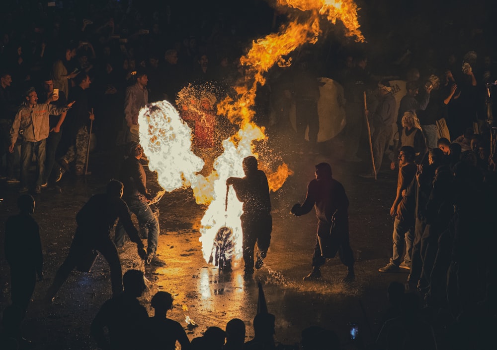 a group of people around a fire