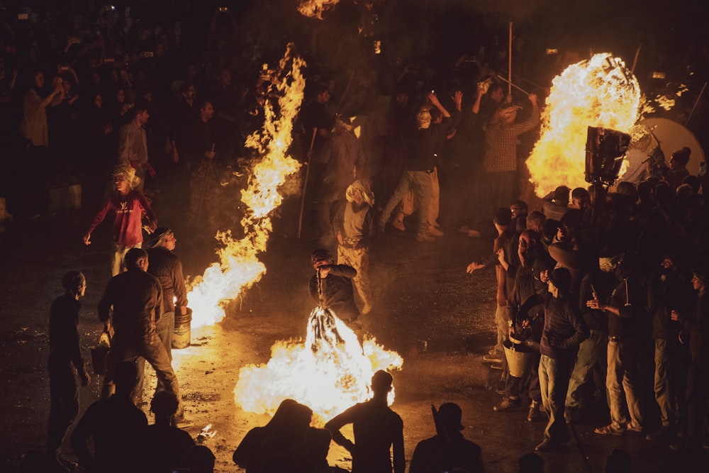 a group of people around a fire