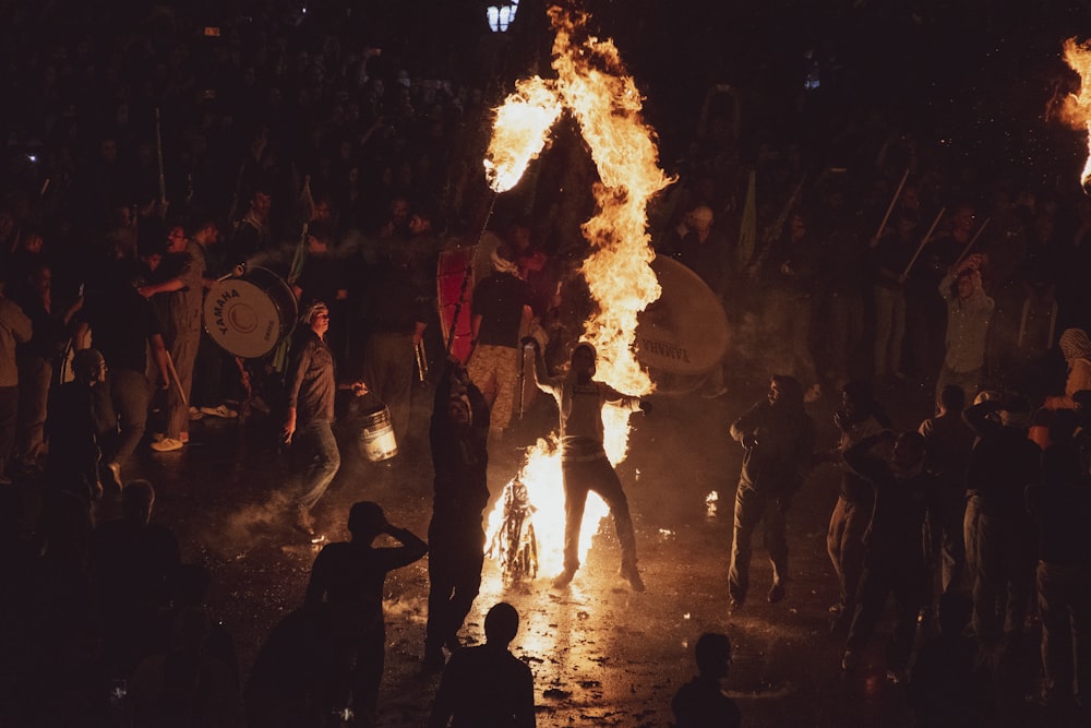 a group of people around a fire