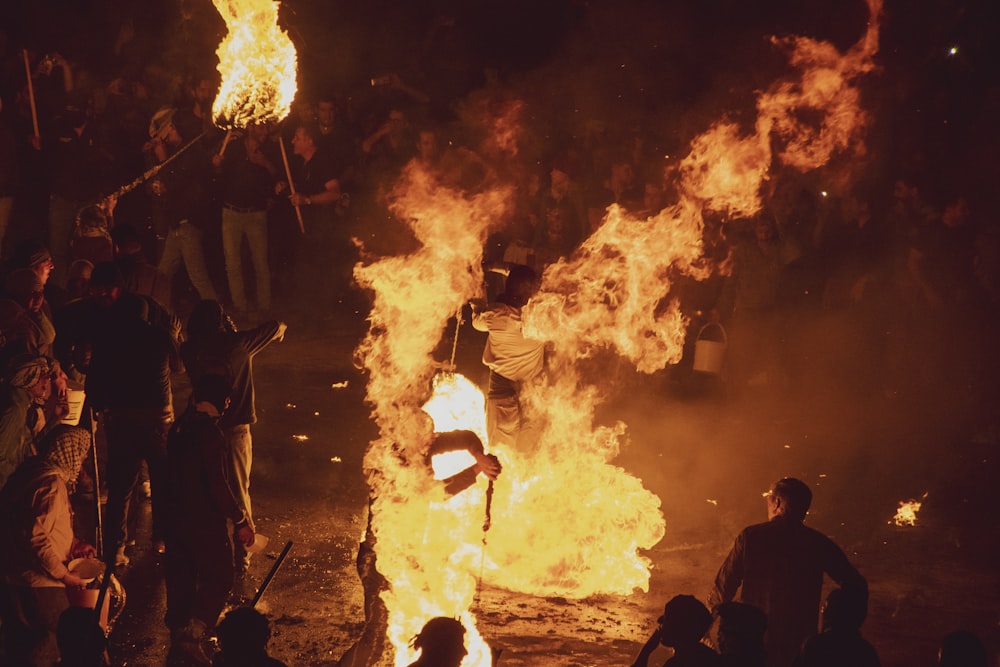 a group of people around a fire