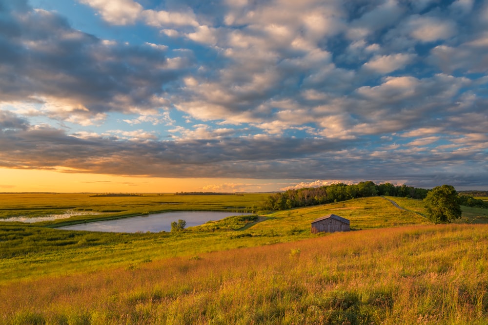 a small house on a grassy hill