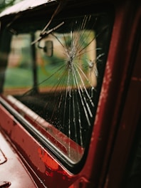 a bus is reflected in the side mirror