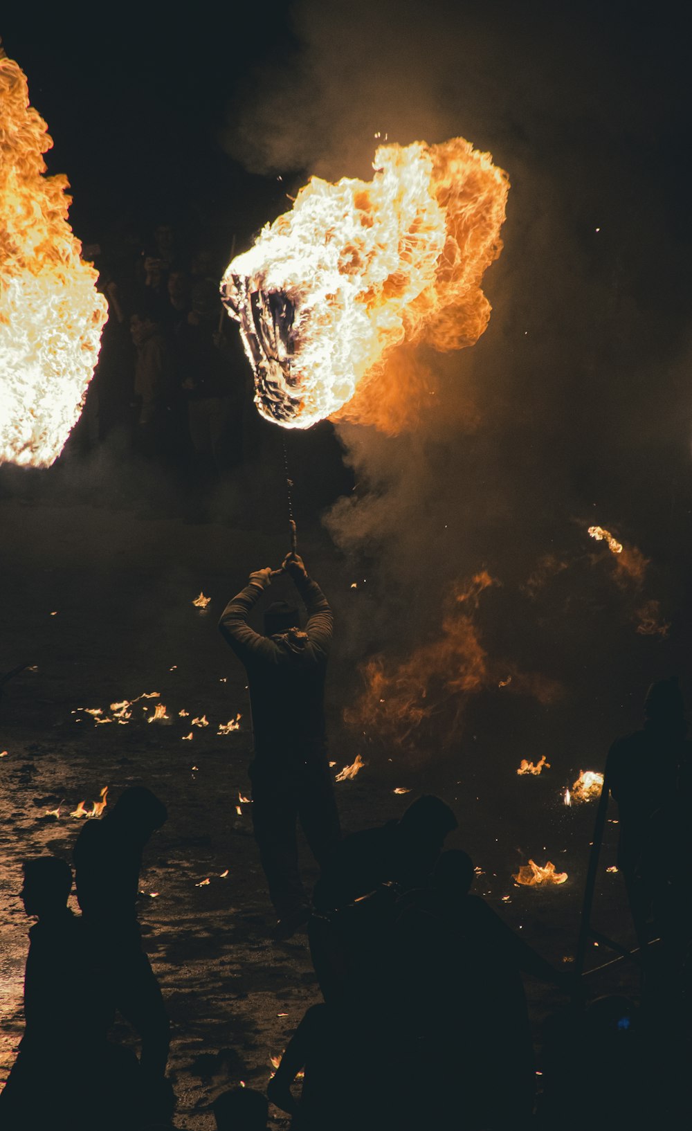 a group of people around a fire