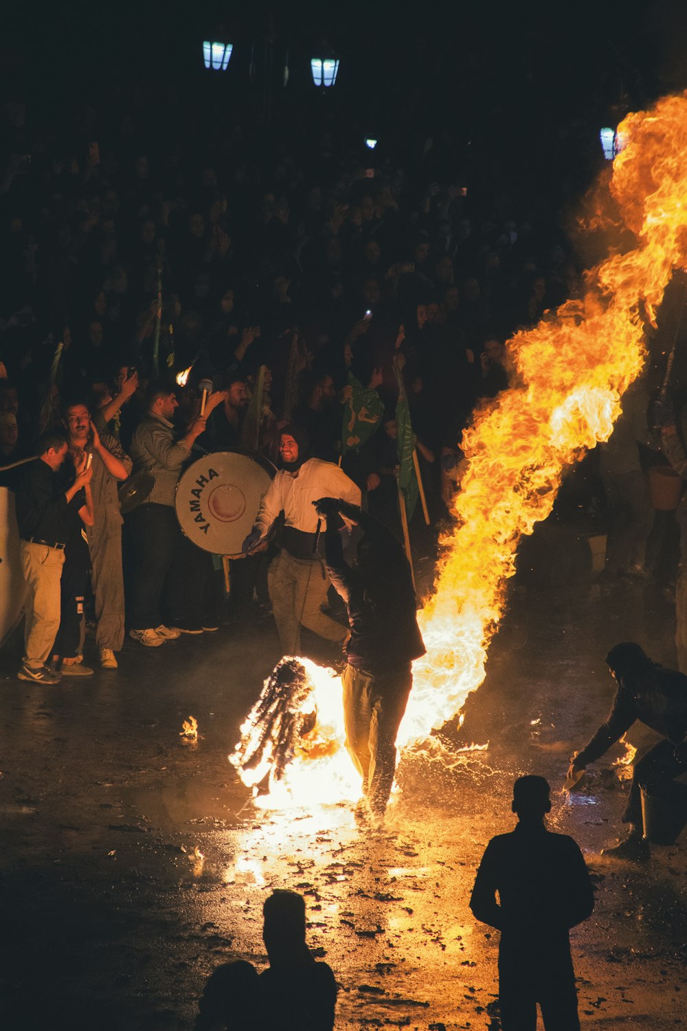 a group of people around a fire