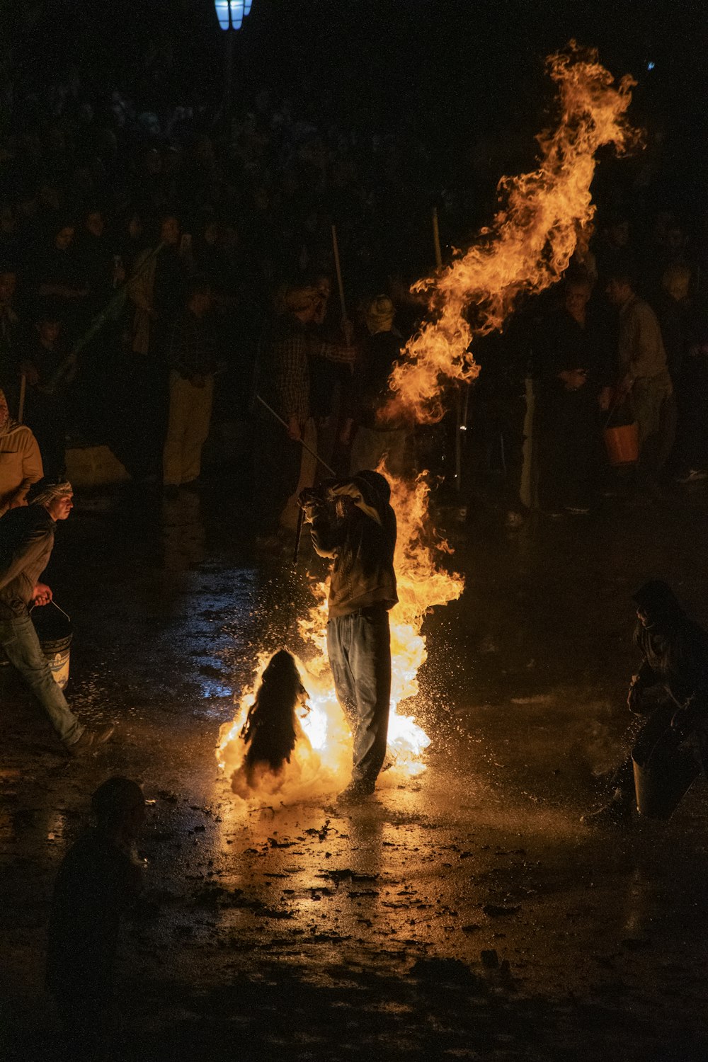 a group of people around a fire