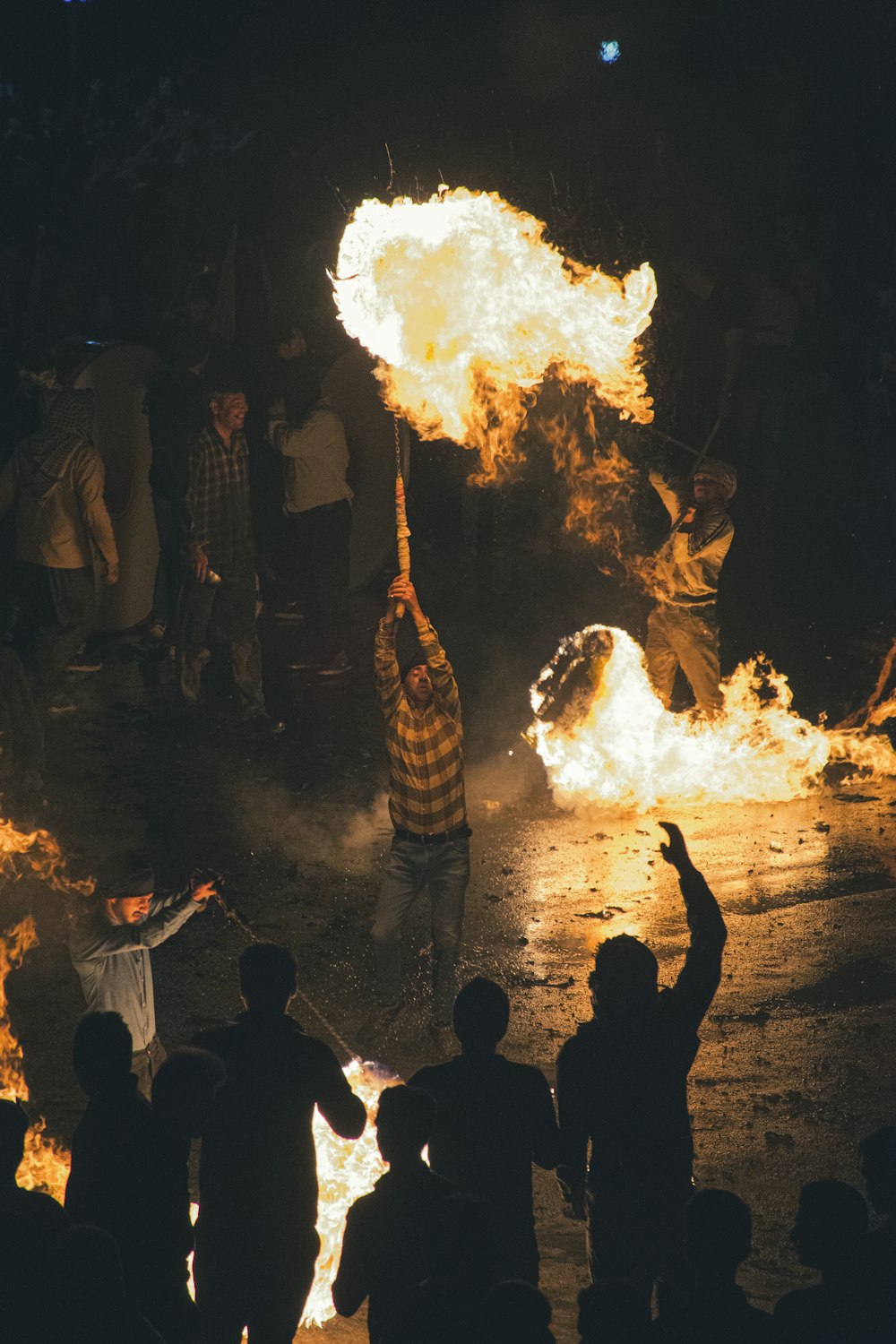 a group of people around a fire