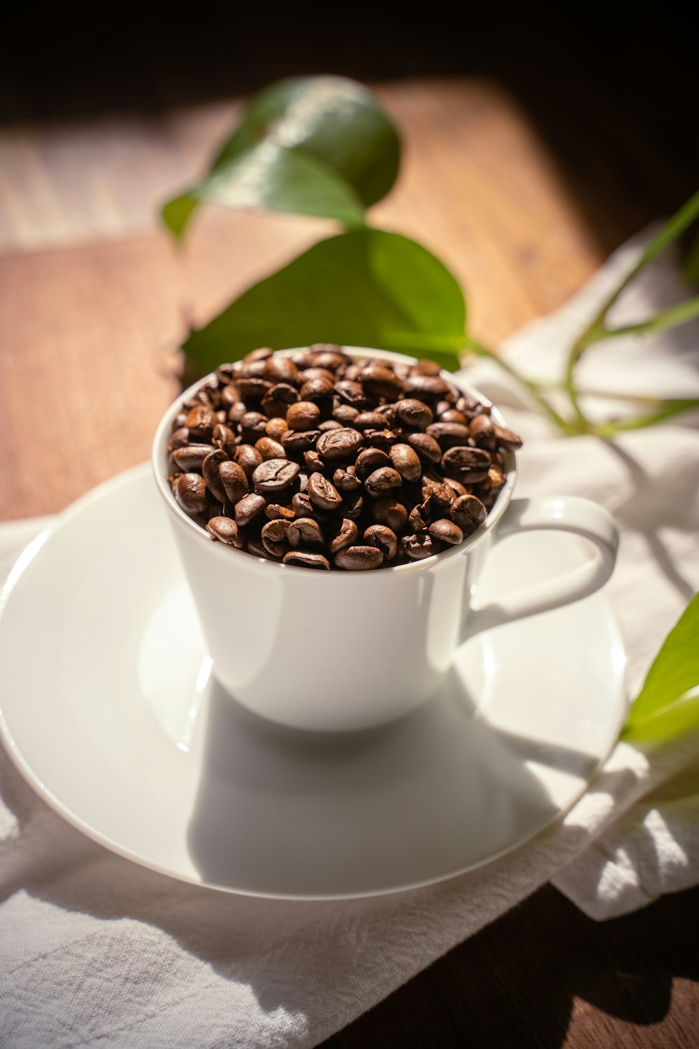 a cup of coffee with coffee beans