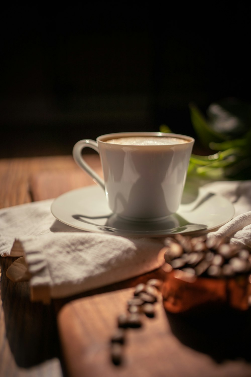 a hand holding a cup of coffee