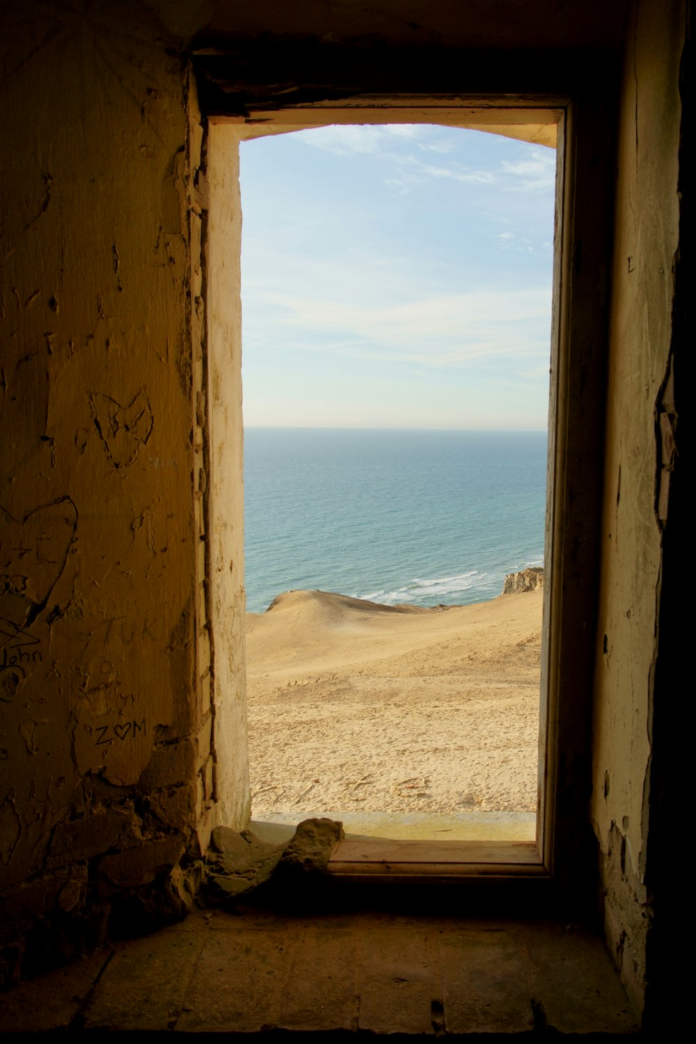 a window looking out to the ocean