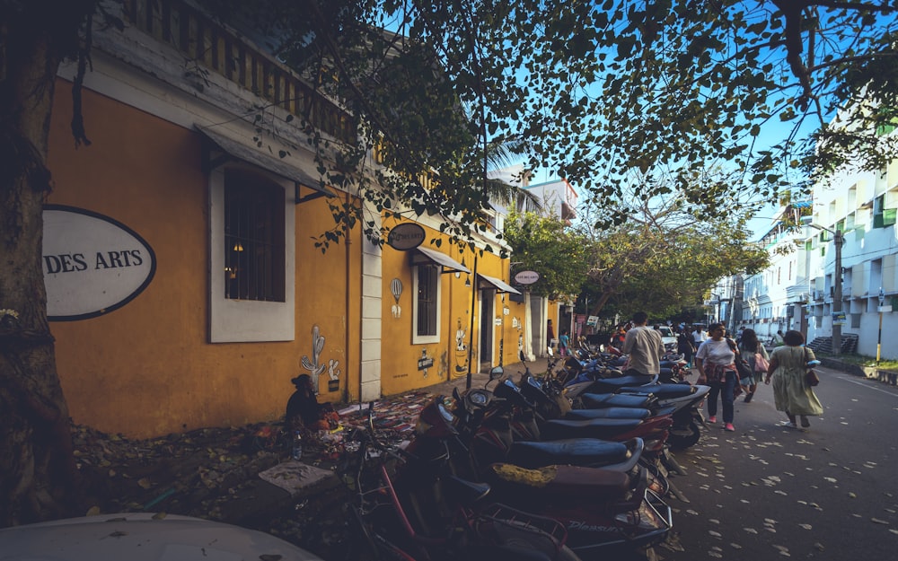 a group of people walk down a street