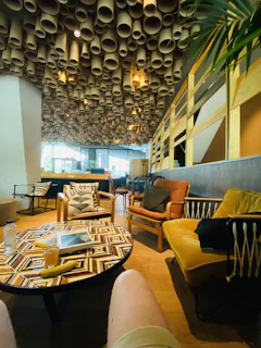 Friendly staff serving tea and juices in a bright, welcoming lounge area.