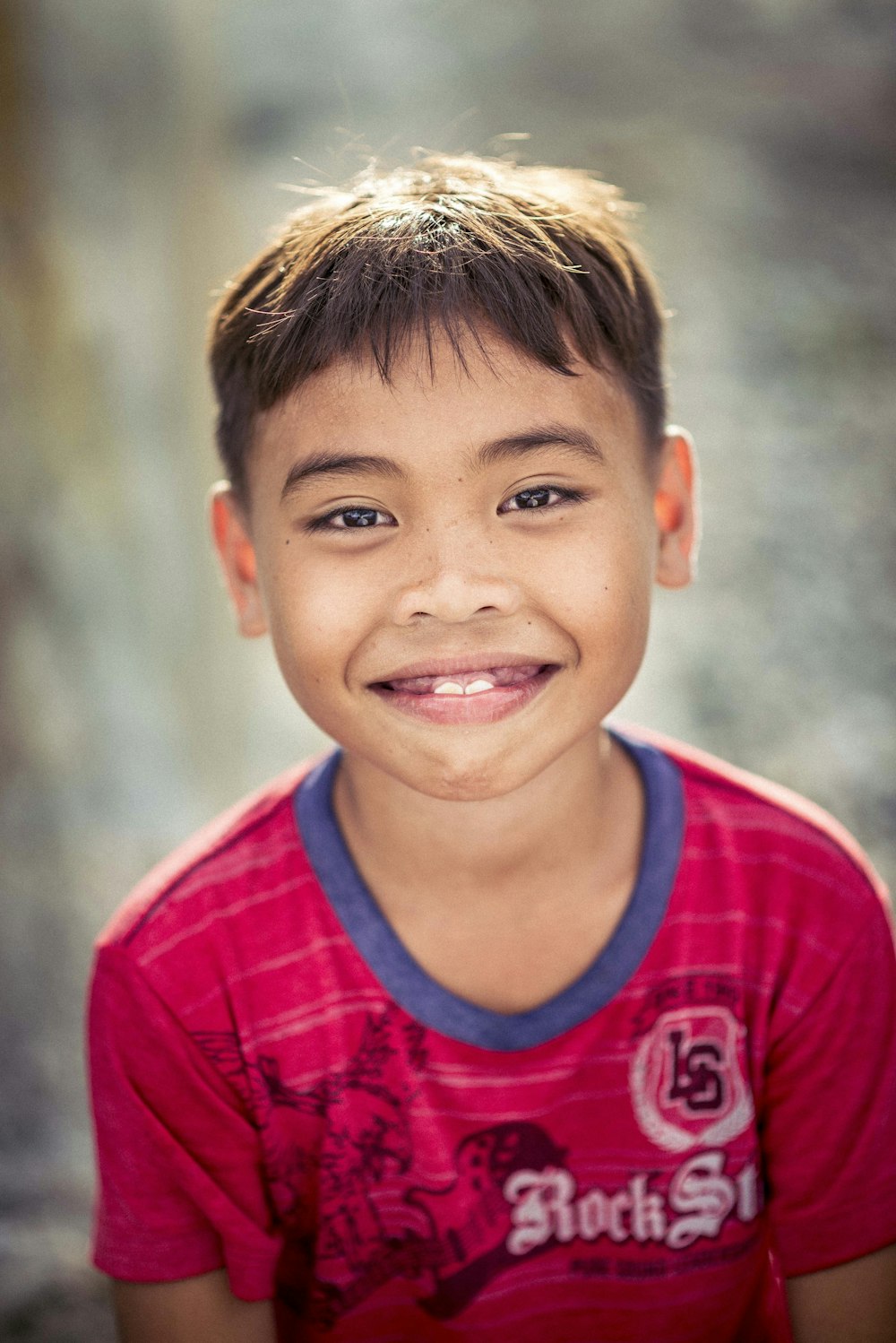 a boy smiling for the camera