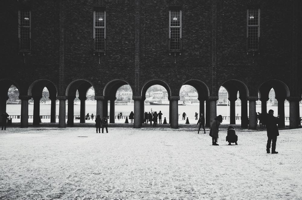 a group of people standing in front of a building