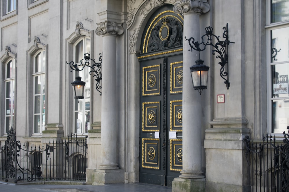 a large gold door with a clock on it