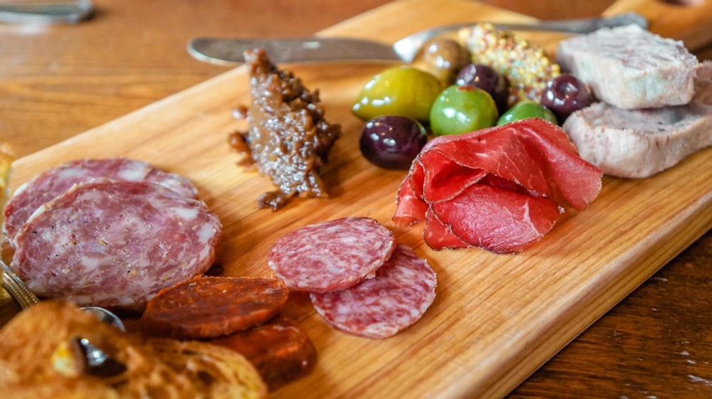 a wooden cutting board with food on it