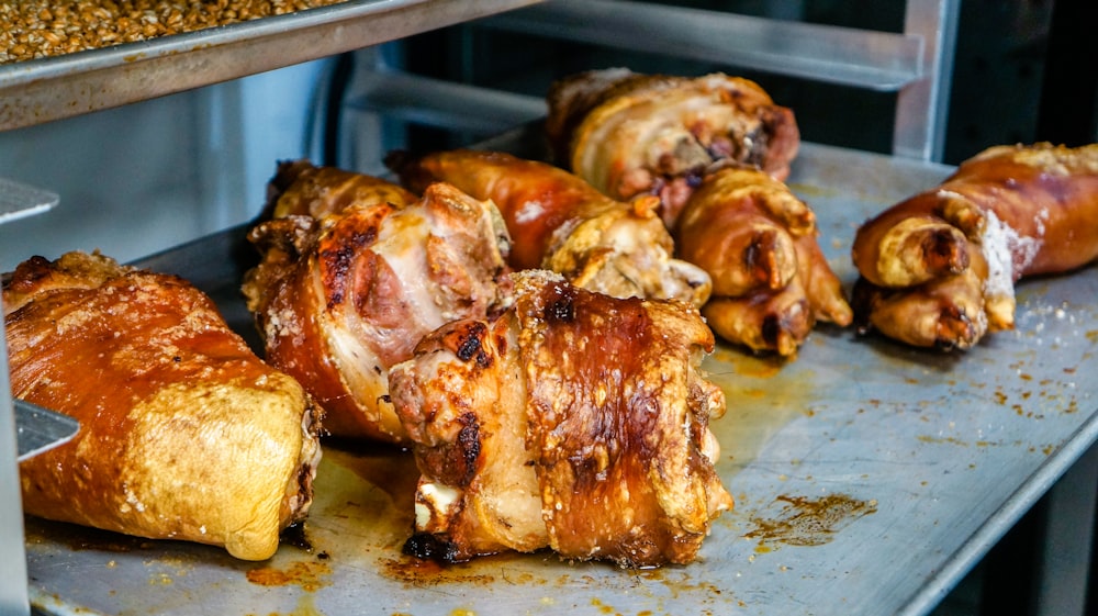 a group of chicken wings on a metal tray