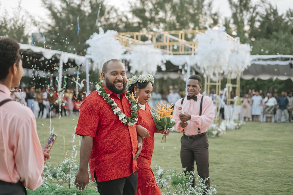 a group of people holding flowers