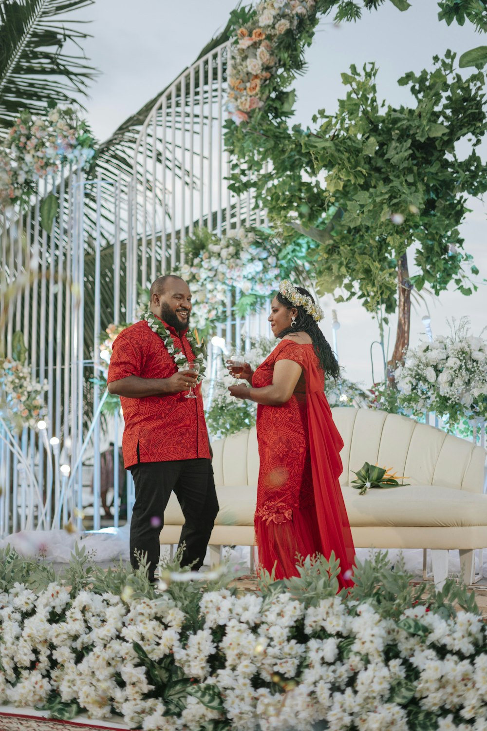 a man and woman in red dress