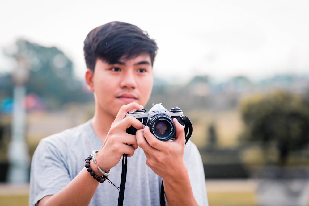 a person holding a camera