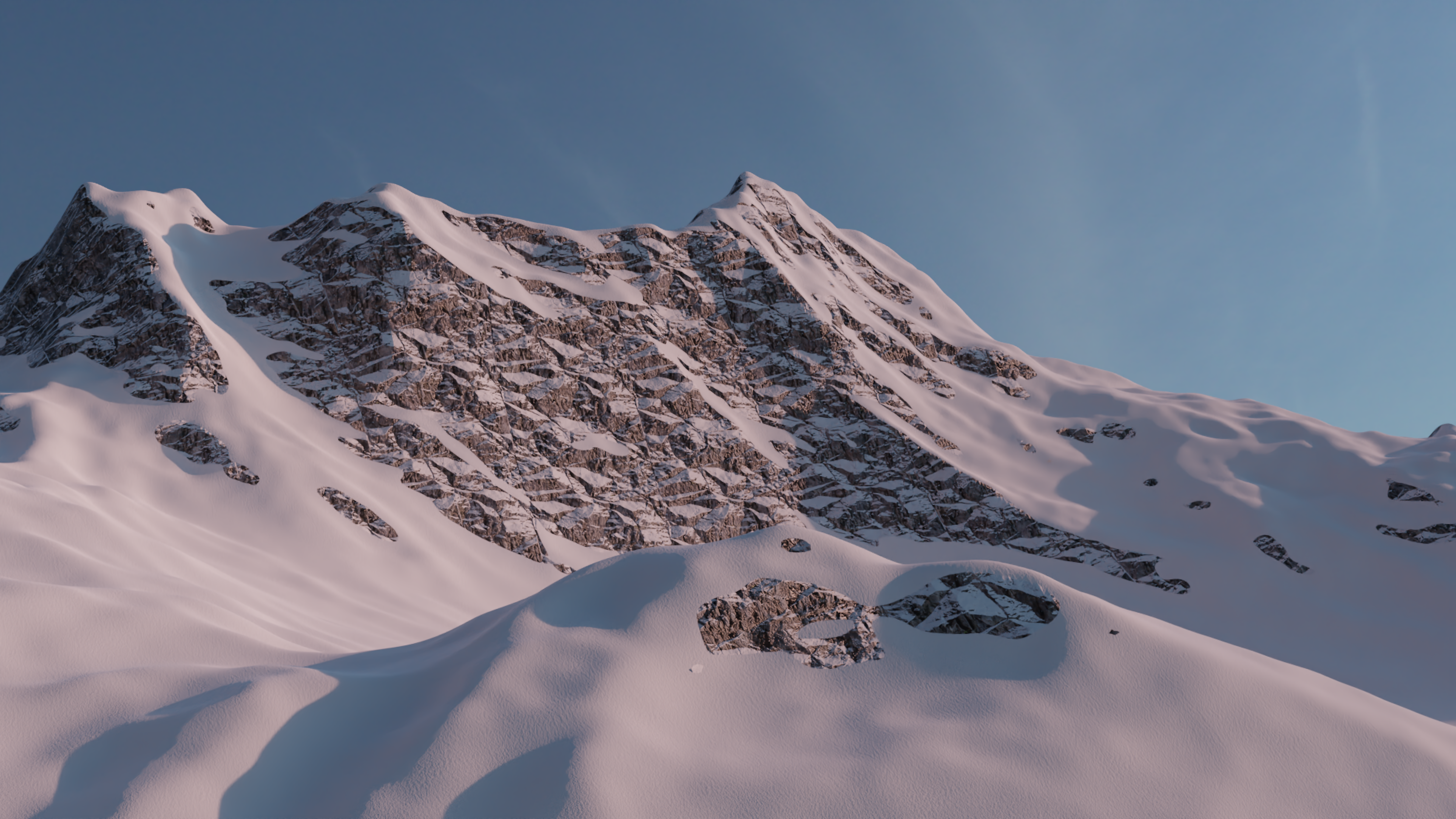 a snowy mountain with a blue sky