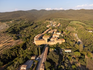 Aerial view of the historic town of Cava de' Tirreni showcasing its medieval architecture and lush greenery.