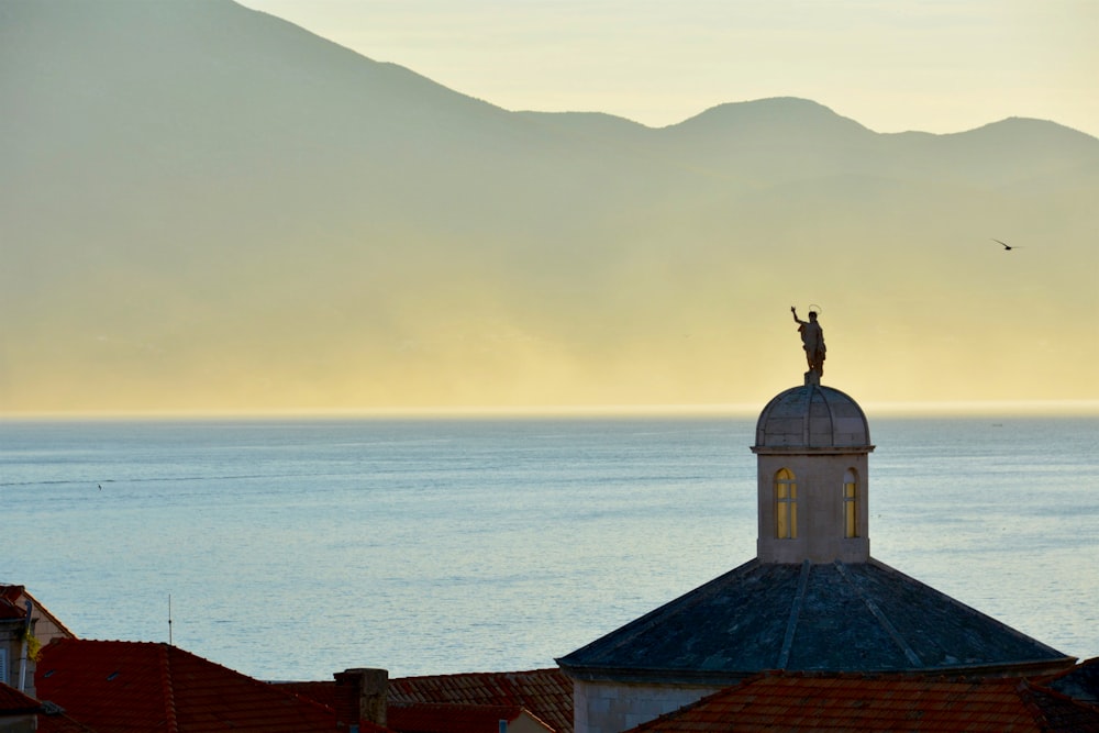 a statue on a roof