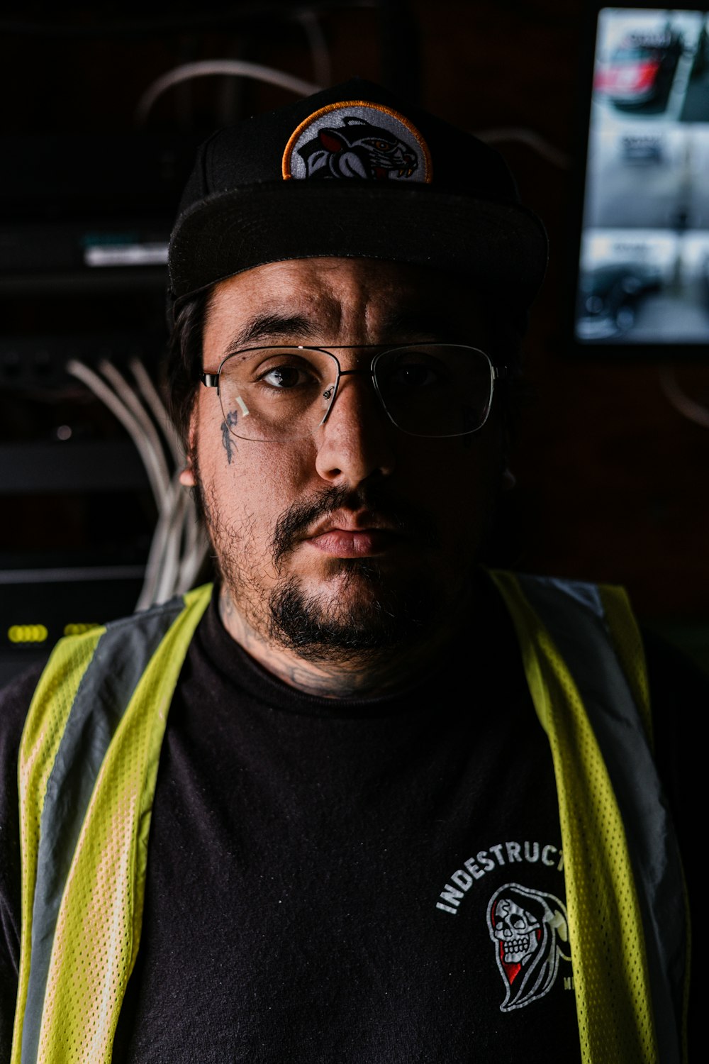 a man wearing a hat and glasses