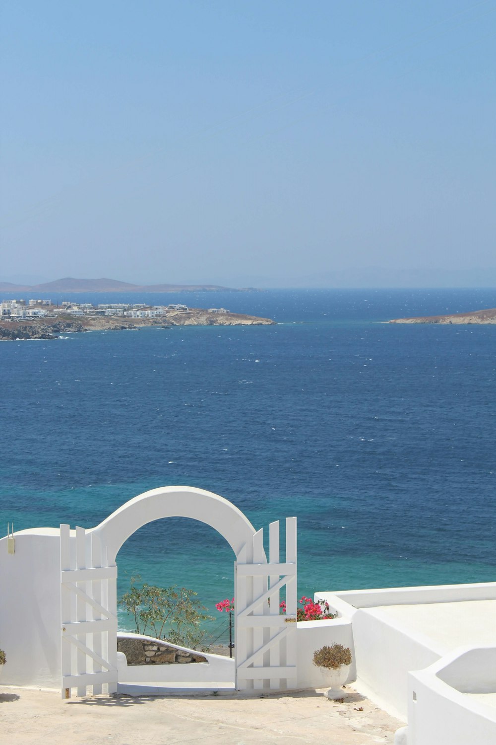 a white building overlooking a body of water