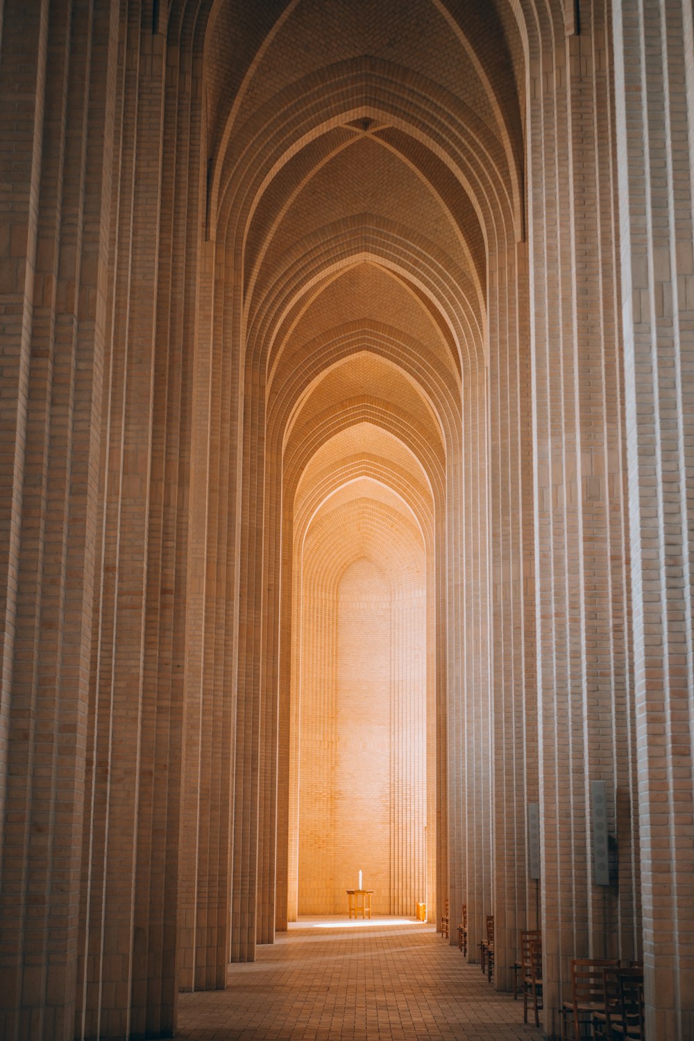 a hallway with tall pillars