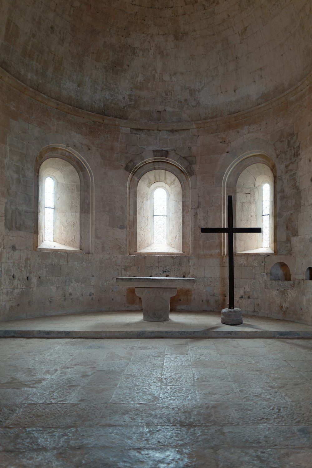 a stone building with arched windows