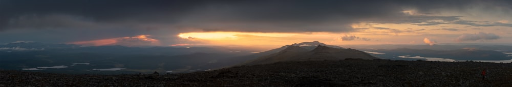 a mountain range with clouds